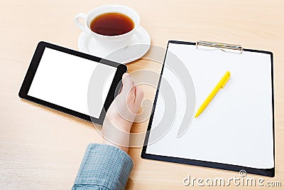 Tablet PC with cutout screen at office desk Stock Photo