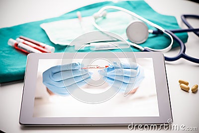 Tablet pc with doctor hand showing a positive test covid 19, microbiology concept Stock Photo