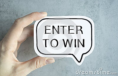 Tablet pc with text Enter to Win with blue Stock Photo