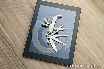 Tablet with penknife Stock Photo
