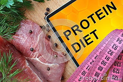 Tablet with protein diet and fresh meat Stock Photo