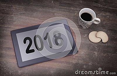 Tablet touch computer gadget on wooden table - 2018 Stock Photo