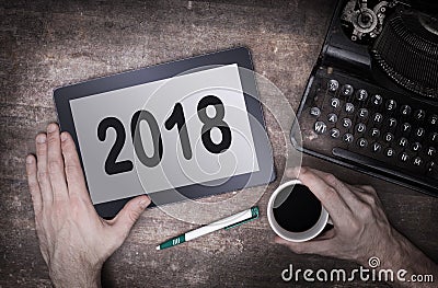 Tablet touch computer gadget on wooden table - 2018 Stock Photo