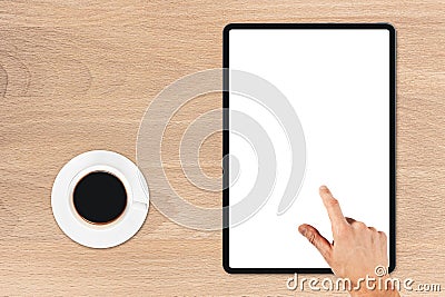 the tablet is on the wood table Stock Photo
