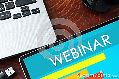 Tablet with word webinar. Stock Photo