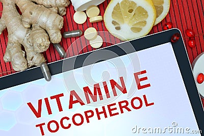 Tablet with words Tocopherol (vitamin E). Stock Photo