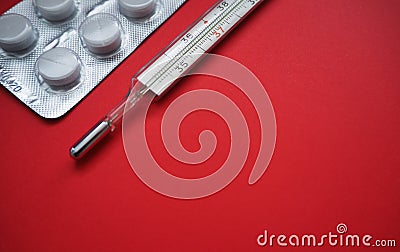 Blister packing tablets with a thermometer Stock Photo