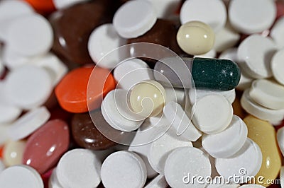 tablets, medical treatment with drugs concept, misuse and drug abuse concept, background of stack and pile of colorful medical Stock Photo