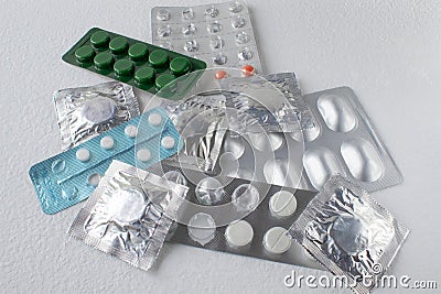 Tablets in packs. Tablets on a light background. Different types of pills Stock Photo