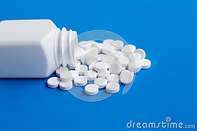 Tablets of Paracetamol on blue background Stock Photo