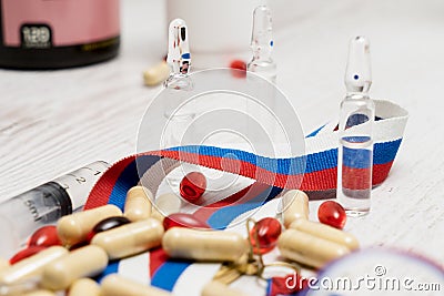 Tablets, pills and syringe of doping drugs or medicine with russ Stock Photo