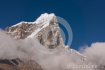 Taboche mountain peak above the cloud at Dingboche village, Ever Stock Photo