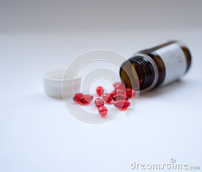 Tabs Vitamins, omega 3, Medications tablets and capsules in a beaker. Stock Photo