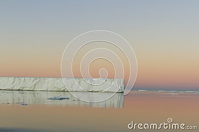 Tabular iceberg reflected in Antarctic Sound Stock Photo