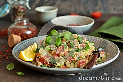 Tabule - a traditional oriental salad with vegetables, parsley and spices Stock Photo