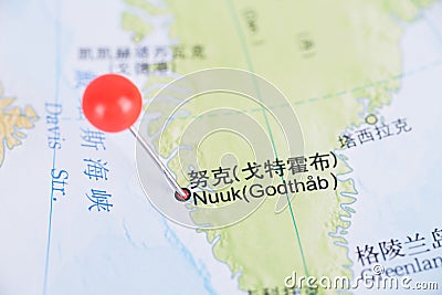 Tack marks the location of Reykjavik, the capital of Greenland, on the map Stock Photo