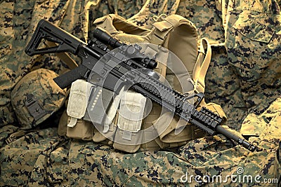 Tactical Rifle resting on vest Stock Photo