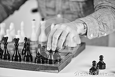 Tactics is knowing what to do. Chess lesson. Strategy concept. Playing chess. Intellectual hobby. Figures on wooden Stock Photo