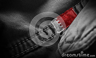 Tag on dark clothing in the form of the flag of the Bahrain Stock Photo