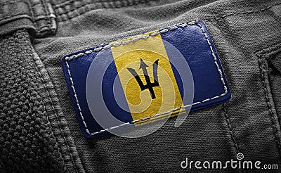 Tag on dark clothing in the form of the flag of the Barbados Stock Photo