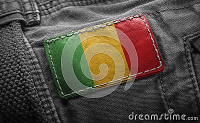 Tag on dark clothing in the form of the flag of the Mali Stock Photo