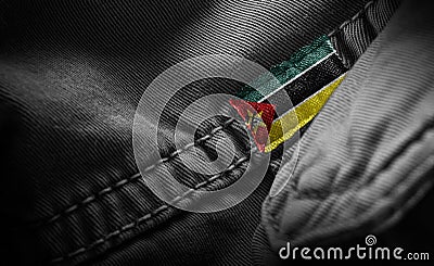 Tag on dark clothing in the form of the flag of the Mozambique Stock Photo