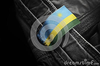 Tag on dark clothing in the form of the flag of the Rwanda Stock Photo