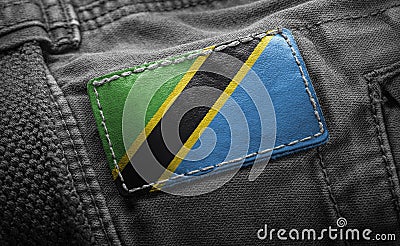 Tag on dark clothing in the form of the flag of the Tanzania Stock Photo