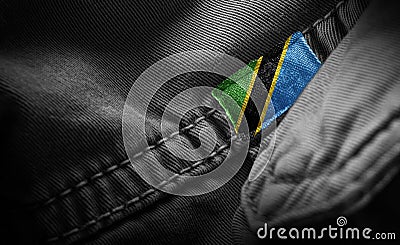 Tag on dark clothing in the form of the flag of the Tanzania Stock Photo