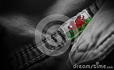 Tag on dark clothing in the form of the flag of the Wales Stock Photo