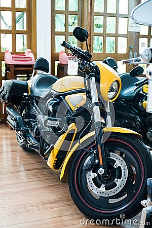 A yellow limited edition of Harley Davidson big bike inside the house Editorial Stock Photo
