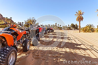 Quads parked in line ready to be rented by tourists. Editorial Stock Photo