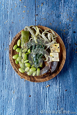 Tagliatelle, kale, edamame, tofu and shiitake Stock Photo