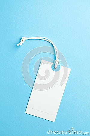 Tags for the price and labels for clothes. White tag mock-up on a blue background. Copy space for text Stock Photo