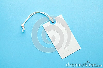 Tags for the price and labels for clothes. White tag mock-up on a blue background. Copy space for text Stock Photo