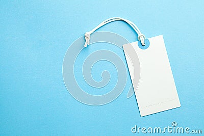 Tags for the price and labels for clothes. White tag mock-up on a blue background. Copy space for text Stock Photo