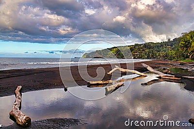 Black sand, Tahiti island, French polynesia, close to Bora-Bora Stock Photo