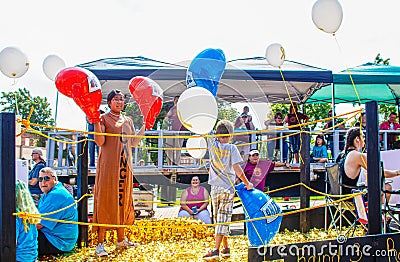 Tahlequah USA .Young boy on parade float in front of judging platform wins mock boxing match against cancer in Cherokee Editorial Stock Photo