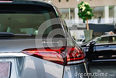 tail light of a grey Mercedes 4matic car in the parking of a car dealership Editorial Stock Photo