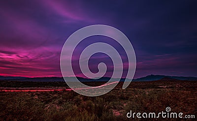 Tail Lights Across The Desert Floor Stock Photo