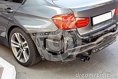 Tail of modern car with removed rear bumper. Vehicle after traffic accident and crash. Transport repair and insurance Stock Photo