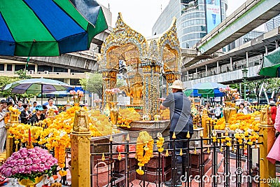 Tailand, Bankok - April 7, 2018: Thailand Bankok San Phra Phrom, Erawan Shine, 4 faces buddha, 4 faced buddha, praying Editorial Stock Photo