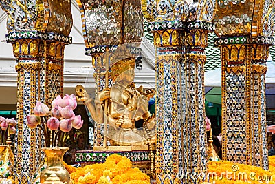 Tailand, Bankok - April 7, 2018: Thailand Bankok San Phra Phrom, Erawan Shine, 4 faces buddha, 4 faced buddha, praying Editorial Stock Photo