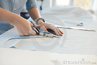 Tailor Hands Cutting Material With Scissors On Table Stock Photo