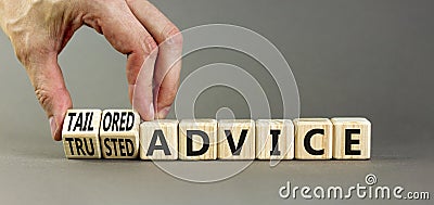 Tailored or trusted advice symbol. Concept words Tailored advice and Trusted advice on wooden cubes. Businessman hand. Beautiful Stock Photo