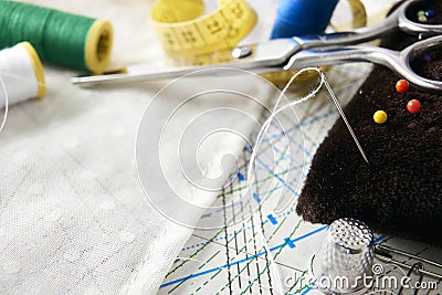 Tailoring tools on clothing pattern and fabric elevated view Stock Photo