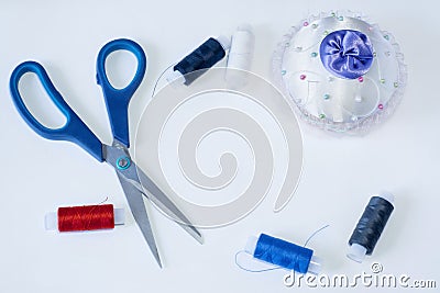 Tailoring tools are scissors needle and threads Stock Photo