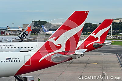 Tails of Jetstar International, Qantas and ANA Cargo aircraft at Changi Airport Editorial Stock Photo