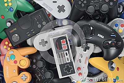 Stack of Retro Video Game Controllers Editorial Stock Photo