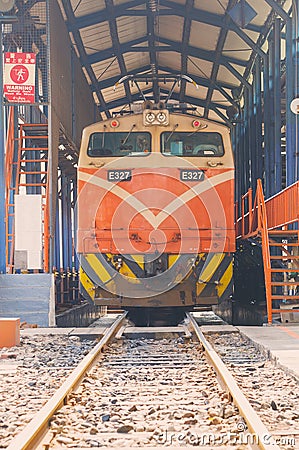 Taiwan Railway Administration TRA E327 Electric locomotive train at railway station. building Asia, design architecture Editorial Stock Photo